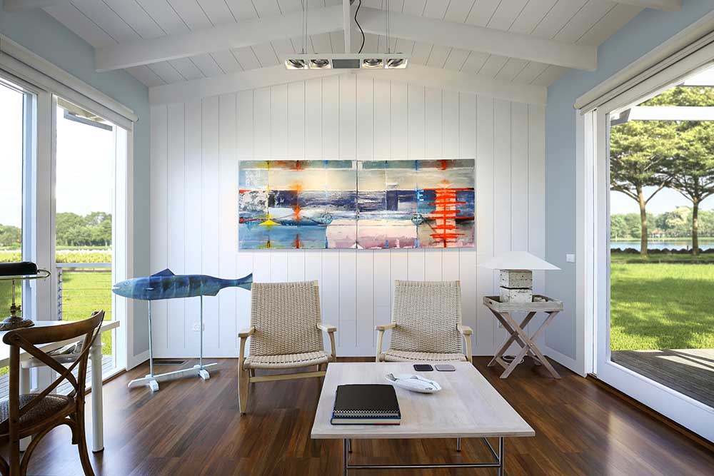 Timeless Farmhouse White Shiplap Living Room With Colorful Painting 