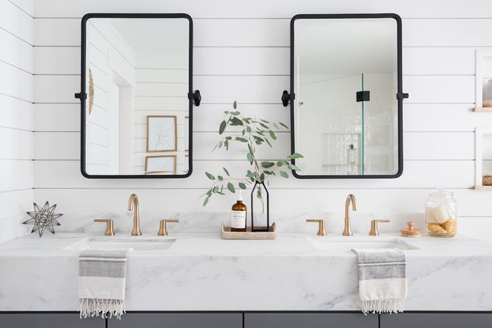 Beautiful white shiplap bathroom with gold accents
