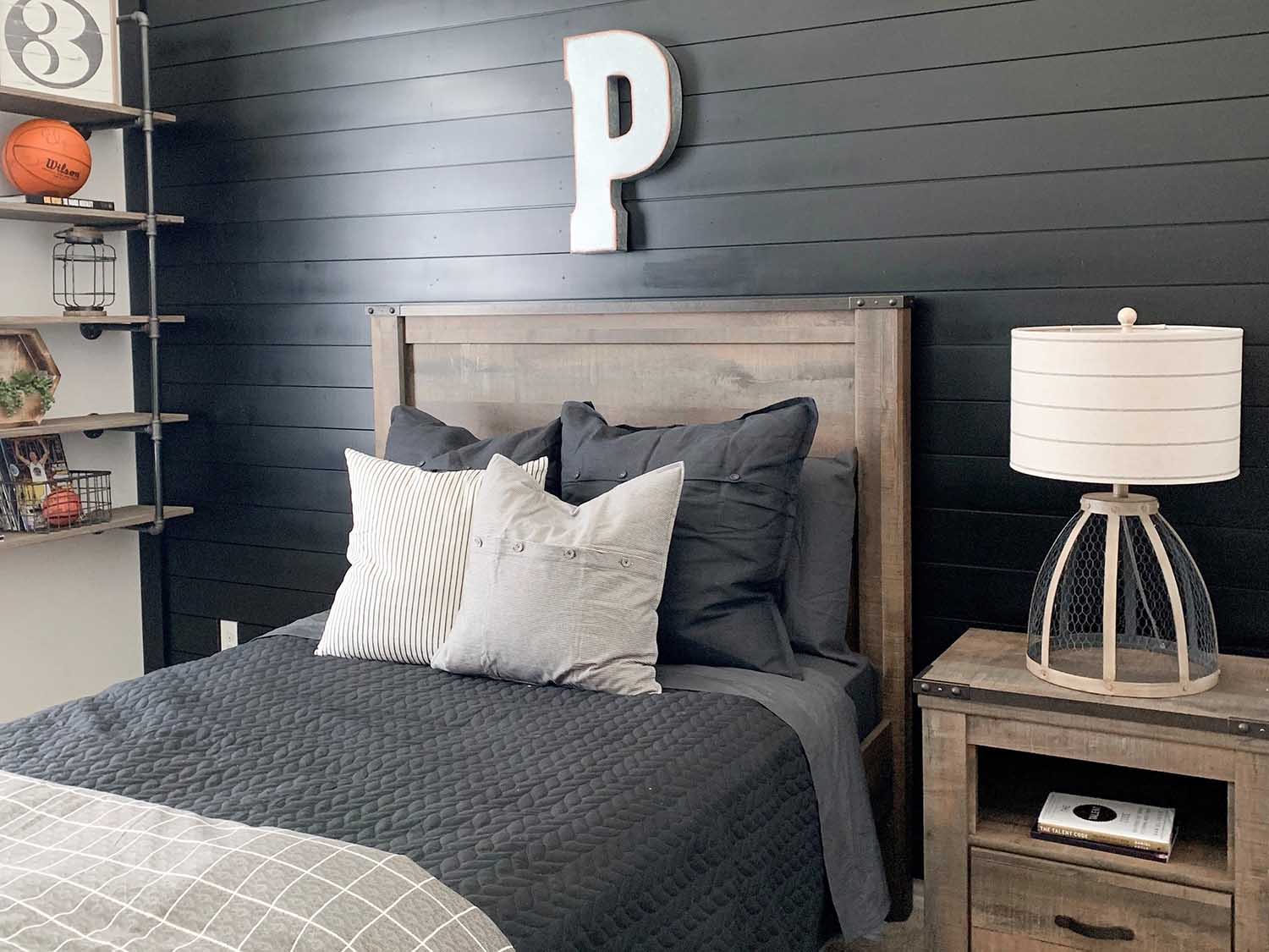 Black outlet shiplap bedroom