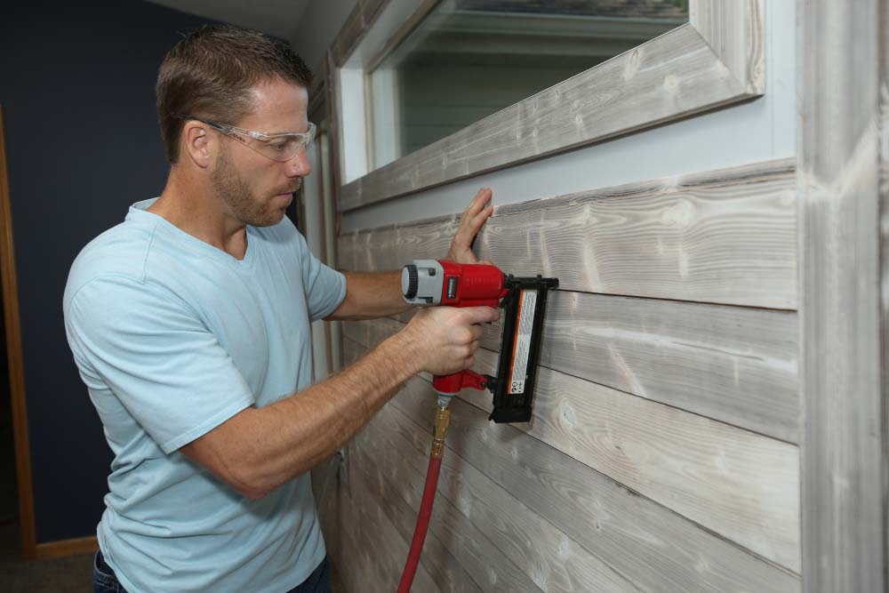 Installing UFP-Edge Smoke White Charred Wood shiplap to an accent wall 