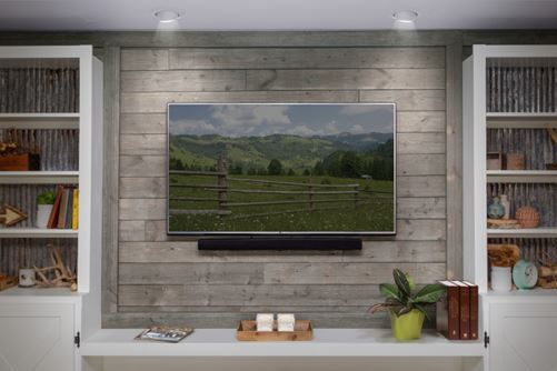 Rustic barnwood gray behind TV