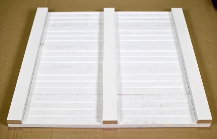 Adhere the three back slats to the diy shiplap sign 