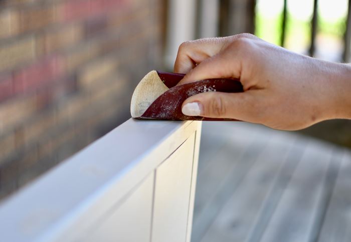 Sand down the wood filler of your shiplap sign