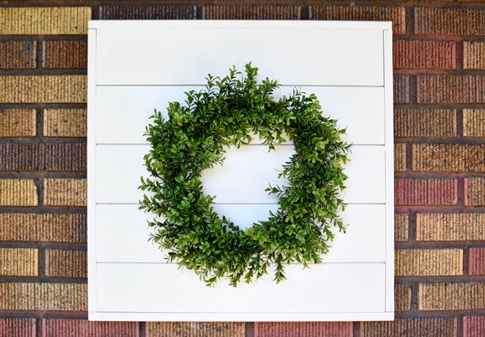 Add a wreath to your shiplap sign