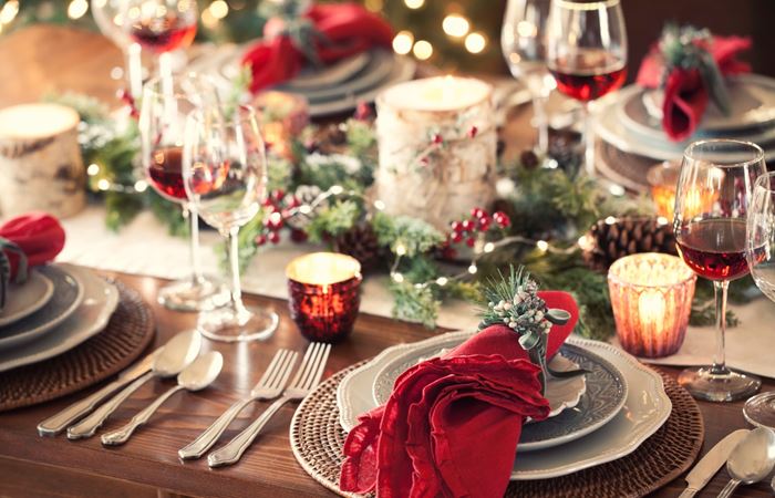 Decorated Holiday Table Natural Decor Sprigs Greenery Candles Place settings