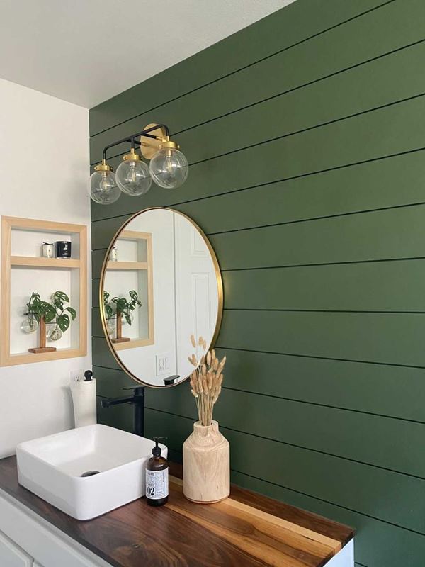 Rich green shiplap bathroom gold mirror wood vanity