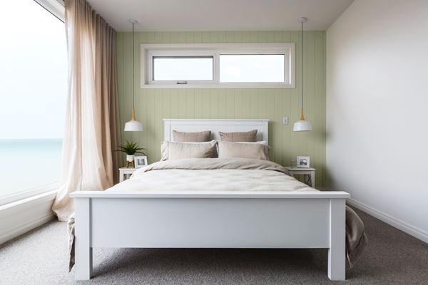 Oceanside bedroom olive green shiplap accent wall