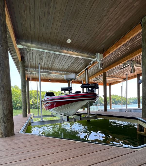 Boat under covered dock ceiling featuring UFP-Edge Thermally Modified Wood Cladding