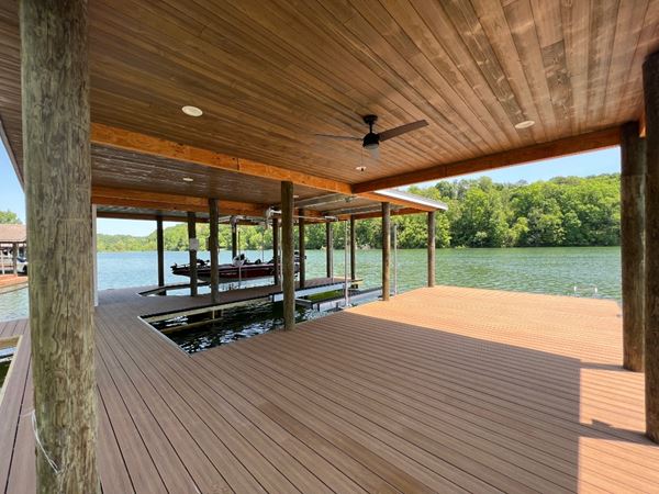 Large covered dock area showing the UFP-Edge Thermally Modified Wood Cladding in Back Country on the ceiling 