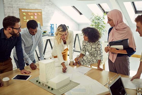 Group of architects meeting over plans