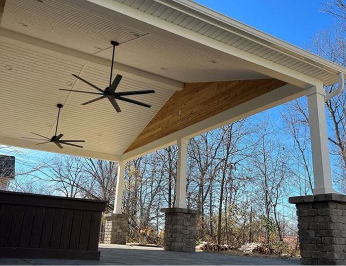 Backyard covered porch ceiling and roof gable accent featuring Thermally Modified Natural wood siding 