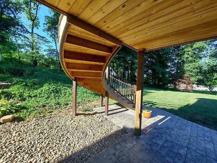Stair underside featuring Thermally Modified Natural wood siding