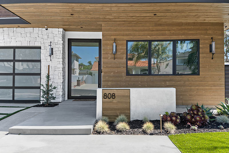 Modern home with thermally modified wood accent siding