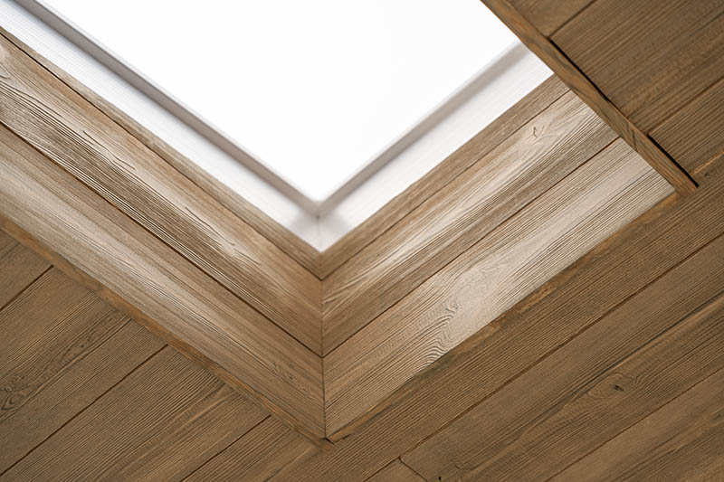 Ceiling window with thermally modified wood cladding application