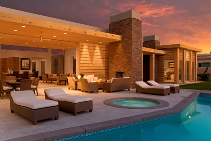 Modern home pool area with wood trim and siding