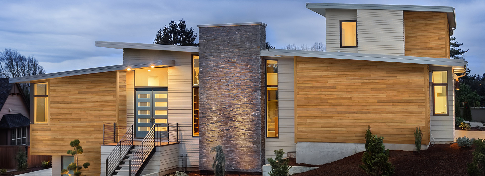 Flat roof modern architecture home with UFP-Edge Thermally Modified VG Hemlock wood siding dusk