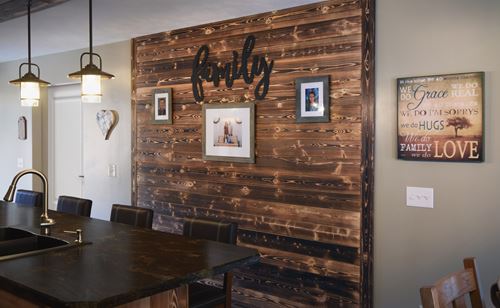 Modern family kitchen and dining room with UFP-Edge natural charred wood accent wall