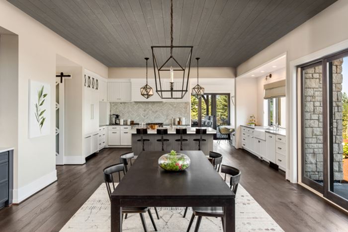 Modern kitchen and dining room featuring UFP-Edge native woods riverwash gray shiplap ceiling application