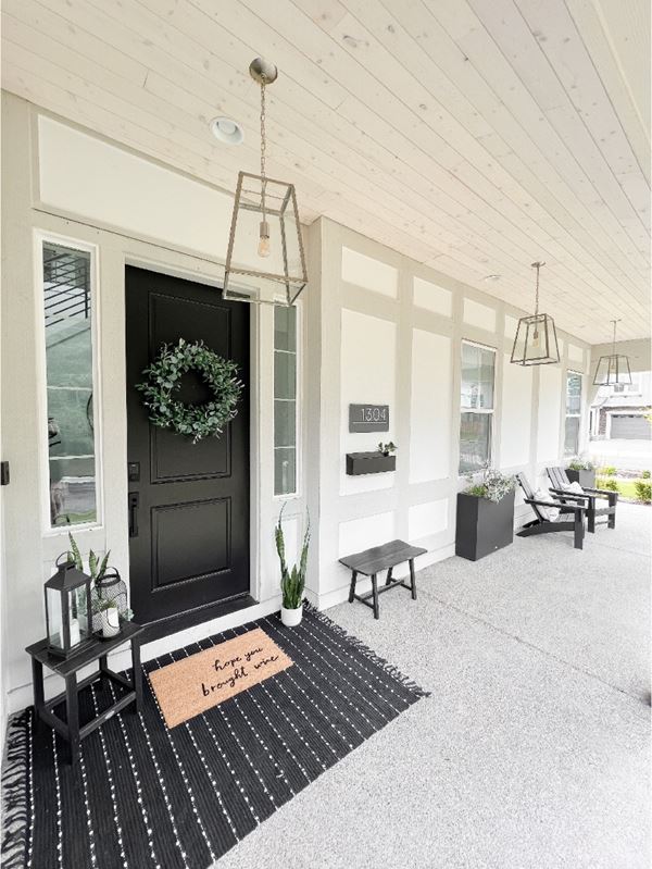 Home front door and covered porch with UFP-Edge alpine white shiplap ceiling application
