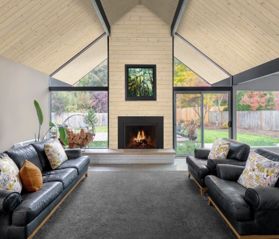 Modern sunroom and fireplace featuring UFP-Edge native woods natural shiplap ceiling application