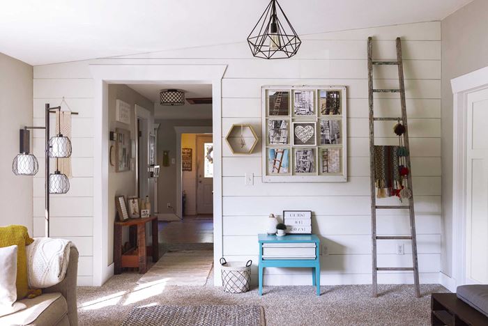 Timeless Farmhouse White Shiplap Living Room With Pictures and Ladder