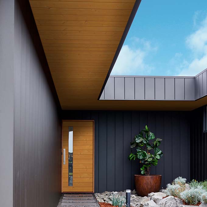 Outdoor walkway with timberland brown native woods pattern board soffit