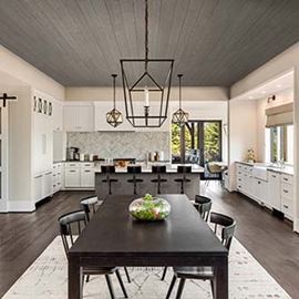 Modern farmhouse kitchen black table Native Woods Riverwash ceiling and island