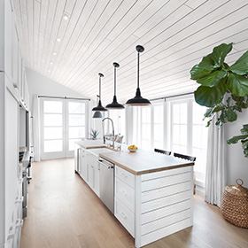 Modern kitchen with white rustic wood shiplap ceiling and bar