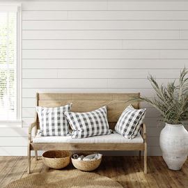Living room area with farmhouse white timeless nickel gap shiplap accent wall