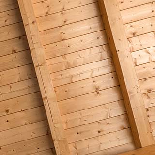 T&G pattern on covered porch ceiling with beams