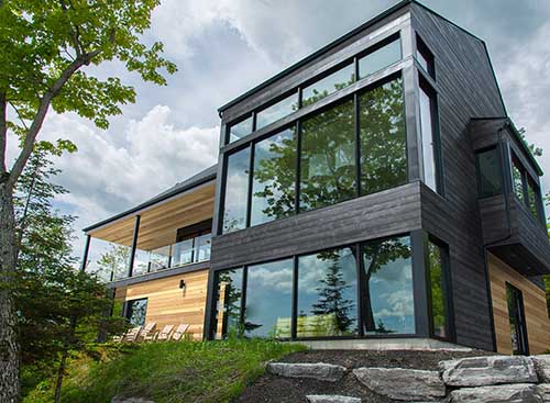 Modern home with UFP-Edge thermally modified wood collection timber ridge black siding
