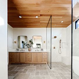 Interior bathroom natural wood tones neutral colors cabinetry shower and tile Thermally Modified VG Hemlock ceiling