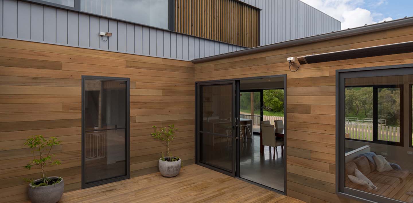 Natural wood siding modern home exterior Thermally Modified VG Hemlock Siding