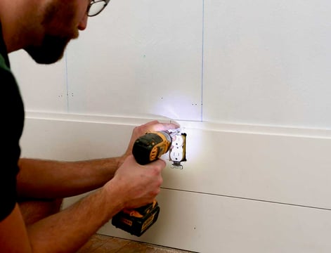 Screwing in outlet over shiplap board