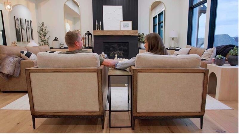 Couple sitting holding hands in living Room featuring VG Hemlock ceiling and Timeless Midnight Black shiplap, Picture